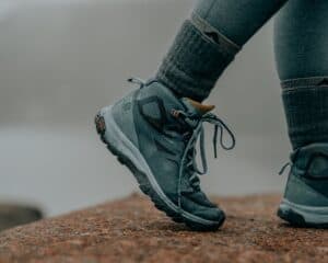 Close up of a woman wearing winter hiking socks.